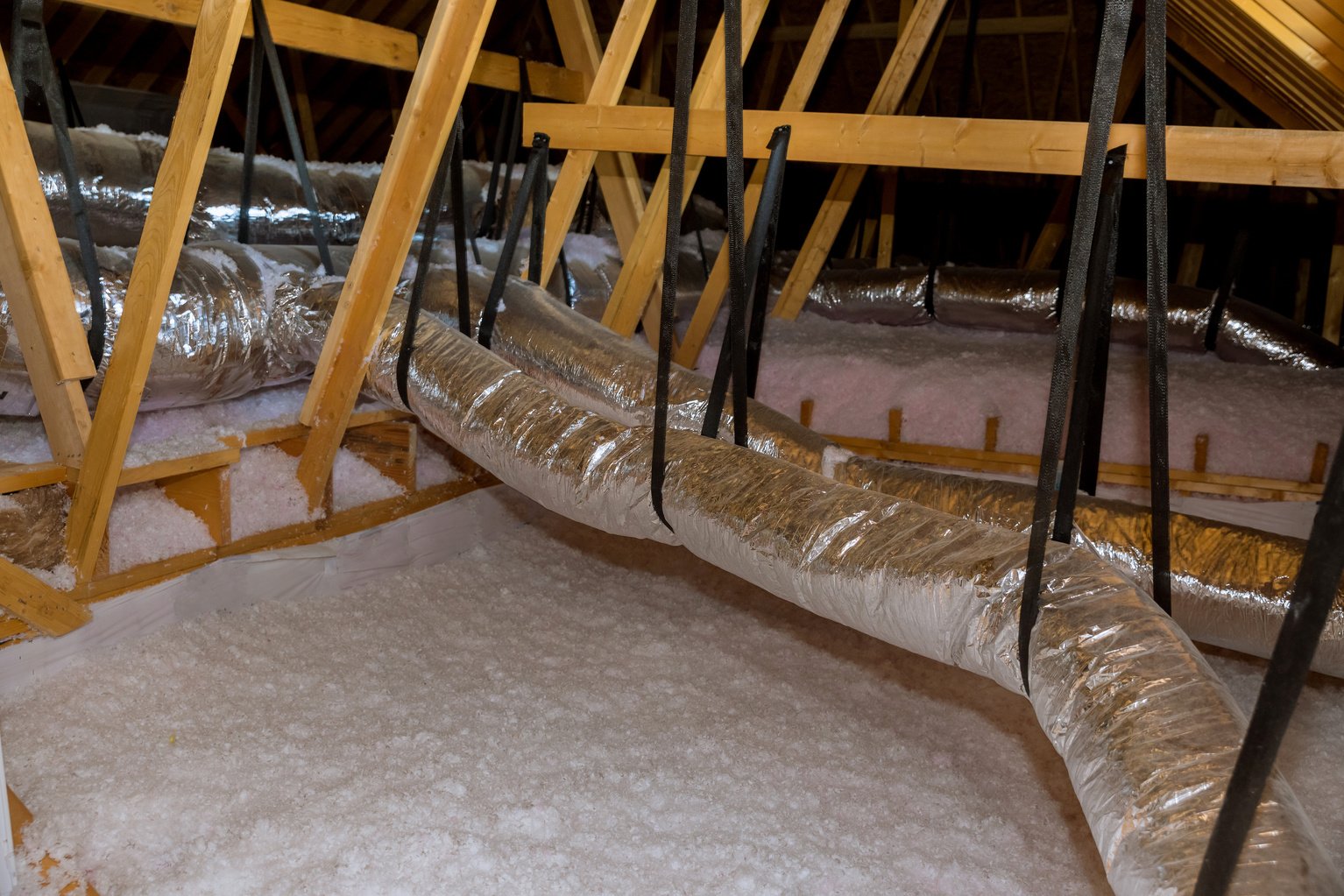 Installing eco wool insulation is poured in the for attic insulation roof to new home